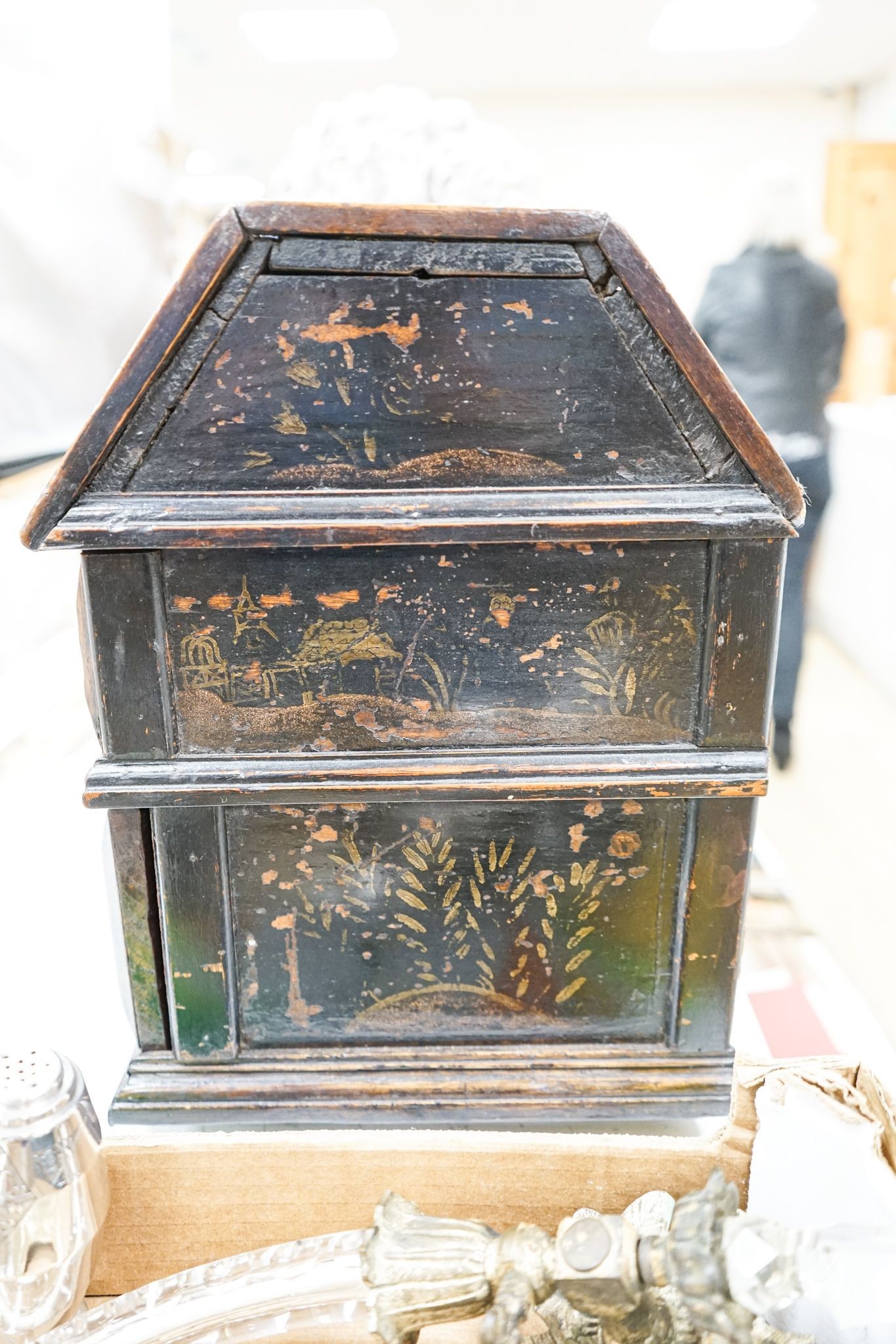An unusual early 18th century Continental painted chestnut, oak and walnut table-top trunk with concealed drawers 38cm